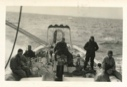 Image of Crew and Donald MacMillan by wheel